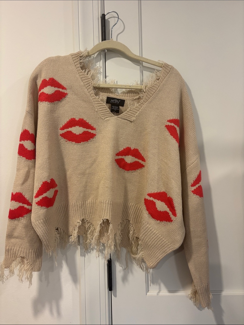 Distressed Beige V-Neck Sweater with Red Lip Motif